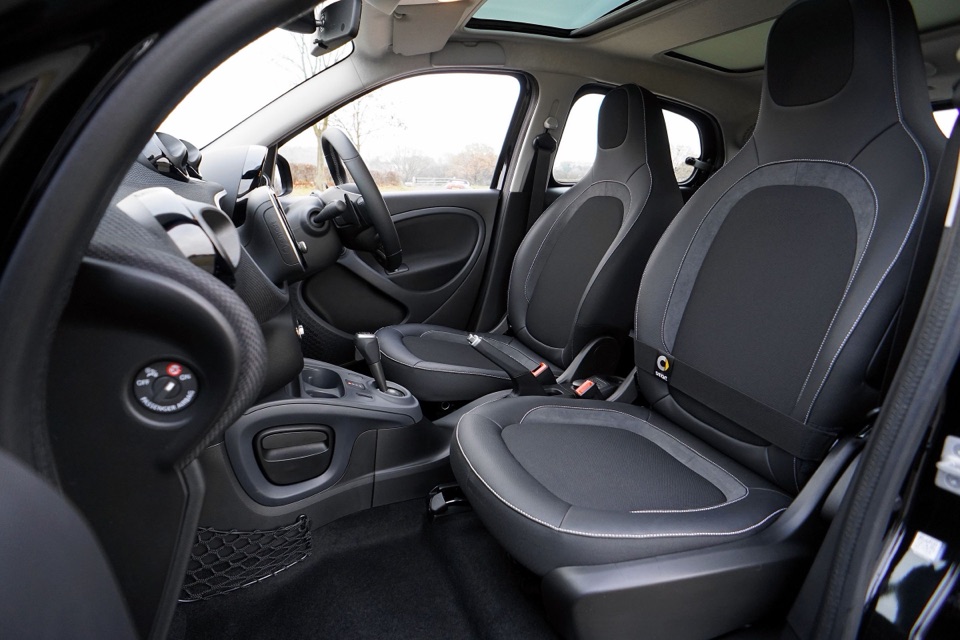 Clean modern car interior with black leather seats